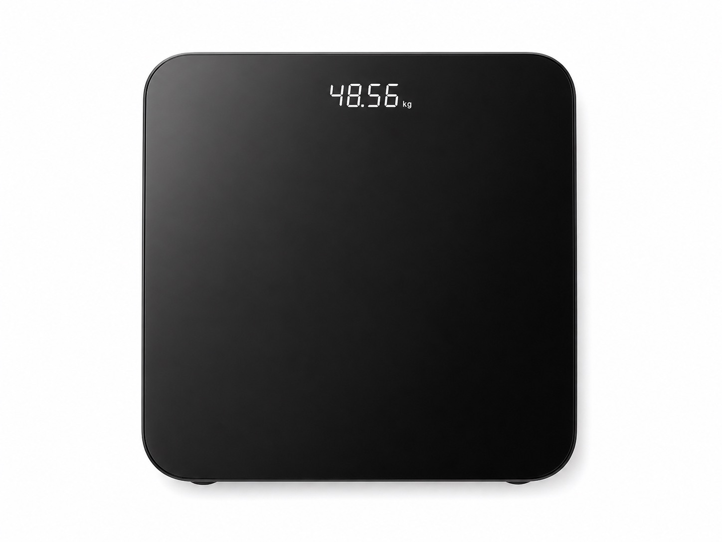 Black smart body fat scale with LED display on a clean background